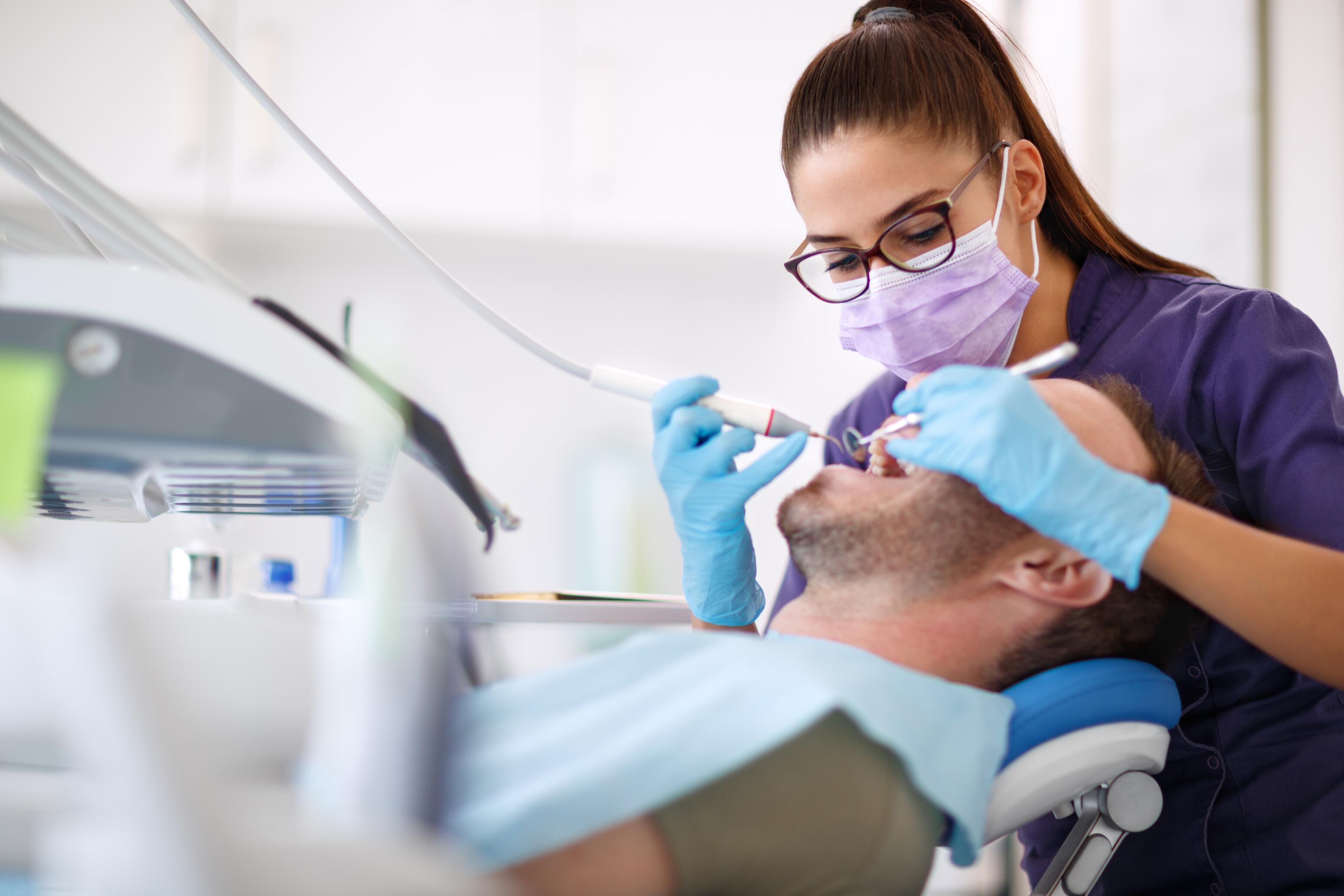 oc_man_dentist_dental clinic_shutterstock_1034571070